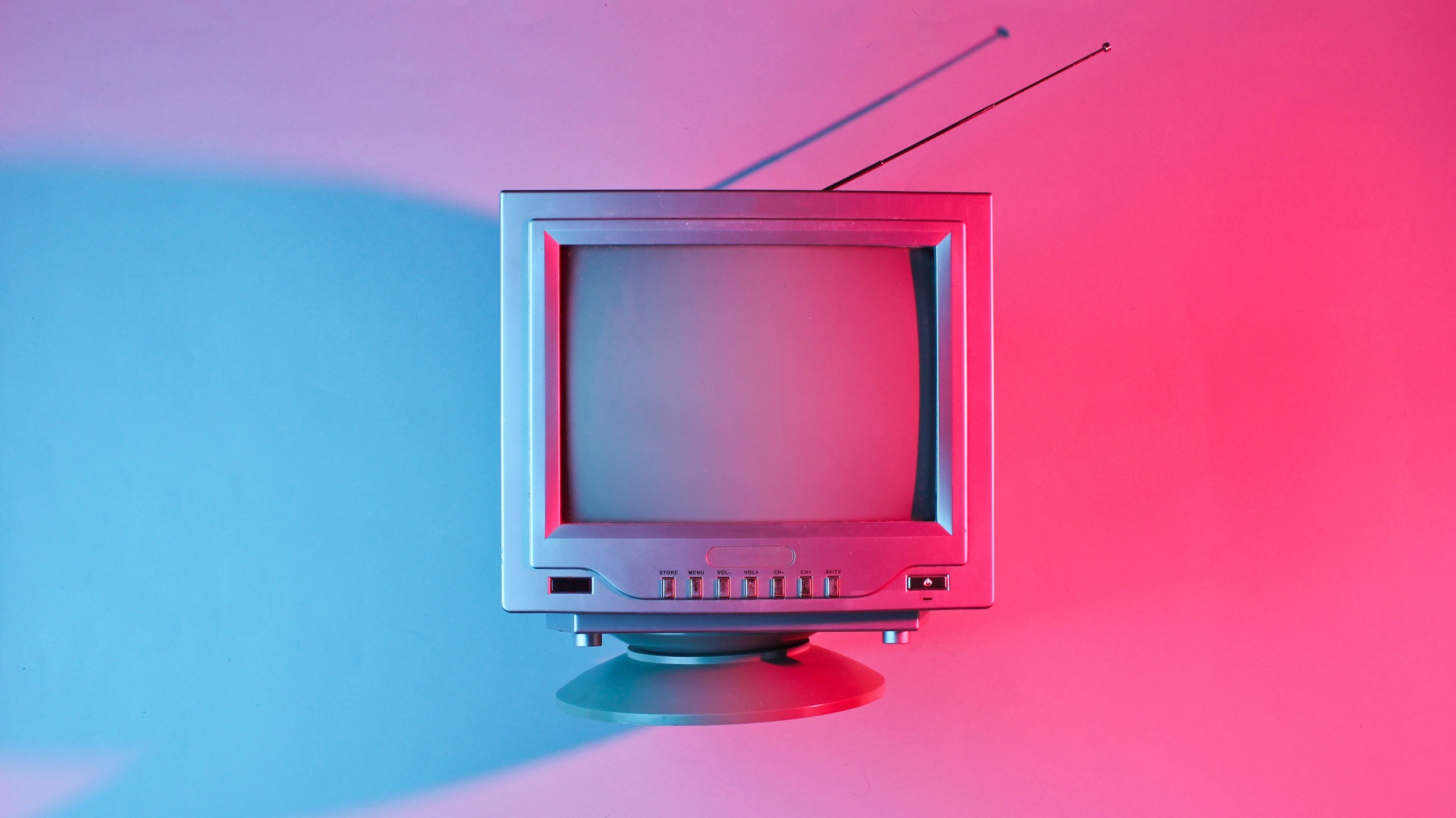 Download Vintage Television Pink Background Wallpaper in 2560x1440 Resolution